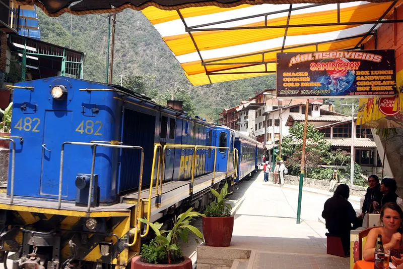 A train running through the centre of Aguas Calientes, the town below Machu Picchu