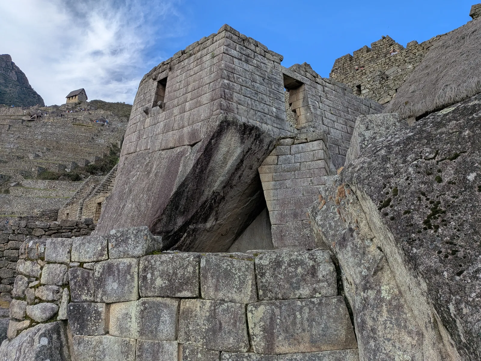 The curved tower of the Temple of the Sun at Machu Picchu, built over a sacred rock