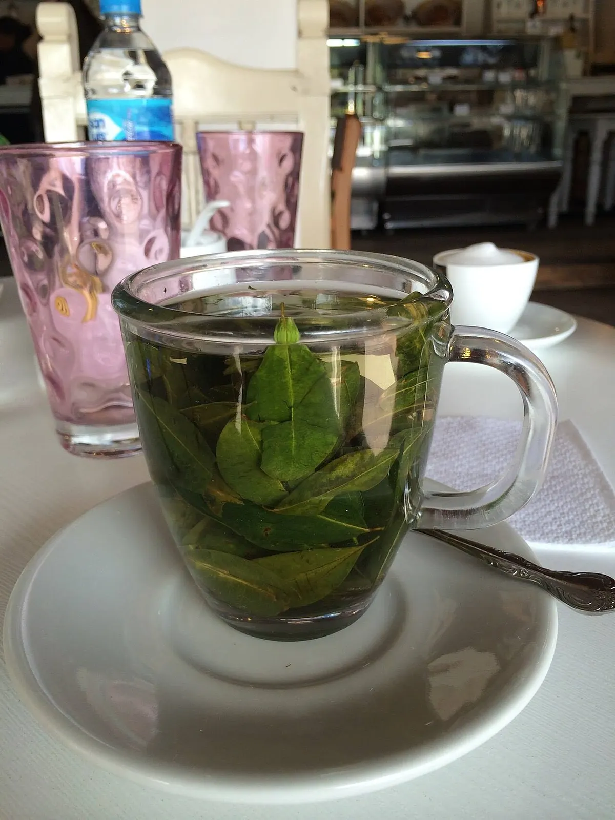 A cup of mate de coca (coca-leaf tea) served at a coffee shop in Cusco