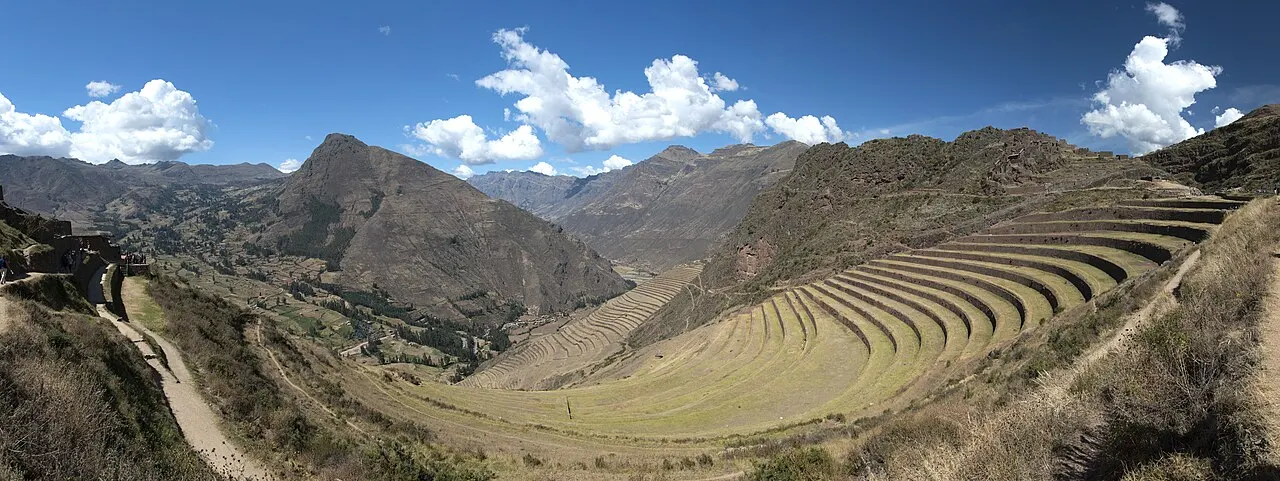 The Inca terraces and ruins of Pisac rising above the Sacred Valley above the market town